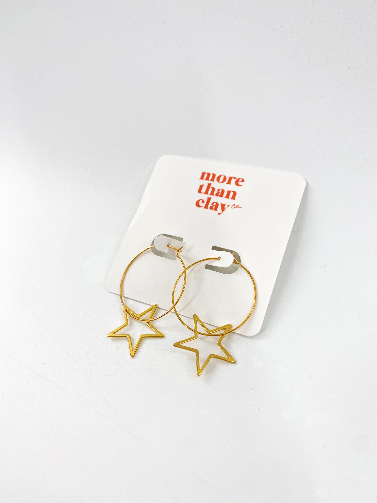 the gold star earrings